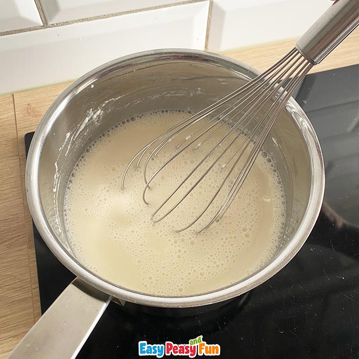 Stirring flour and water to make paper mache glue